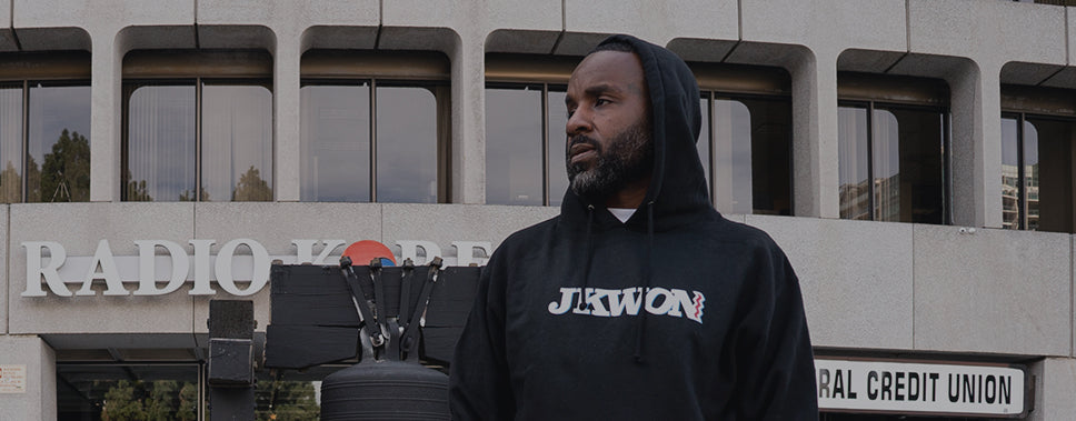 Man wearing JKWON x ST IDES sweatshirt